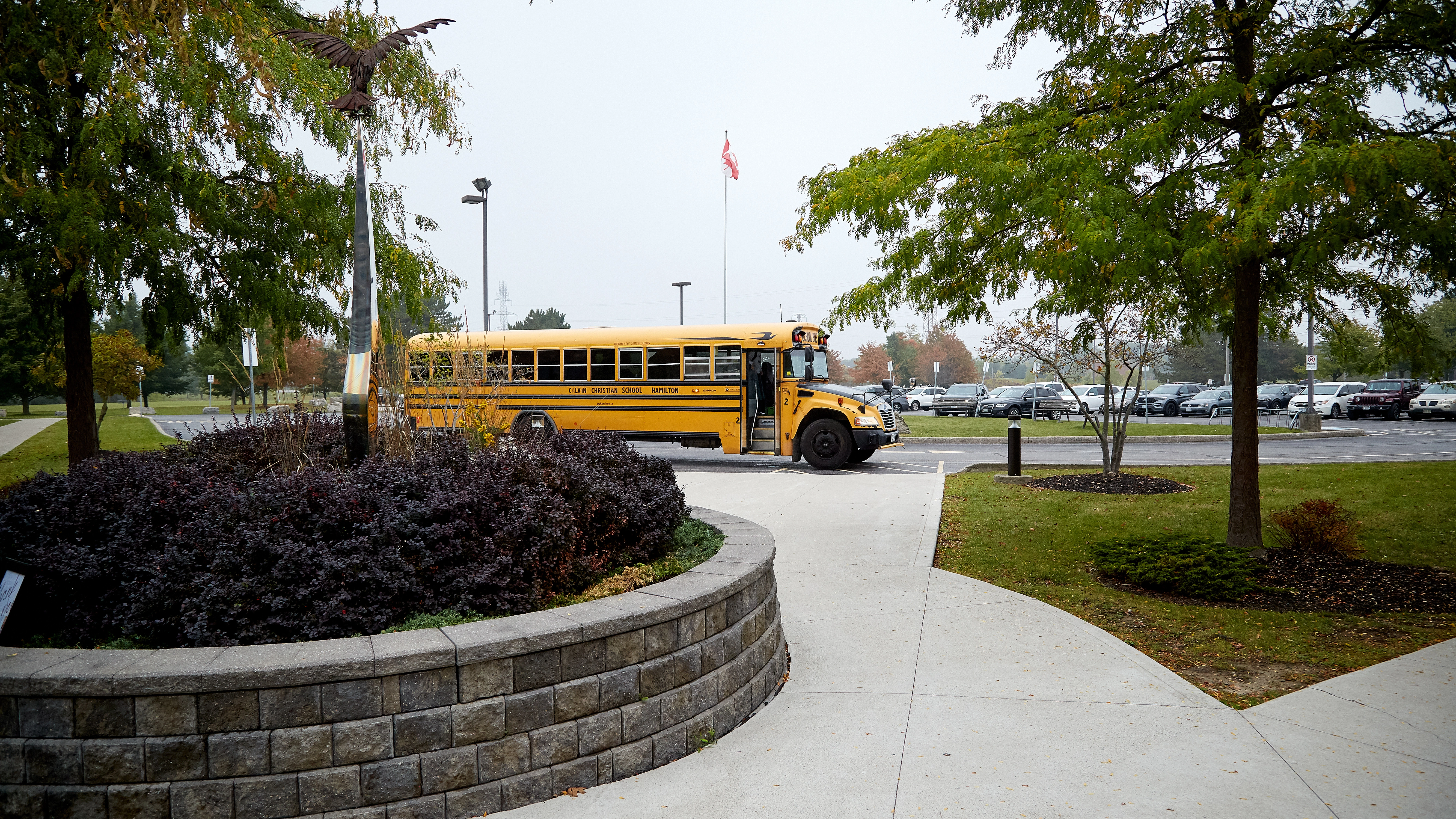 school bus in front of the school