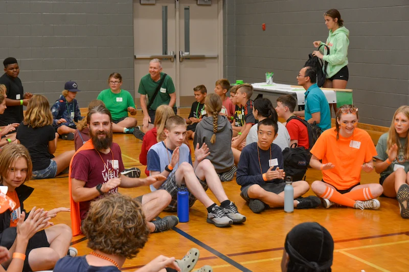 Kids sitting at an assembly