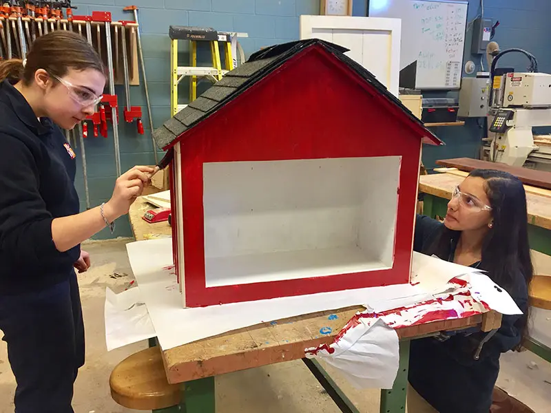 Students creating little library