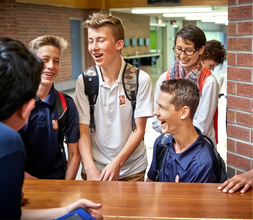 boys smiling in the hallway
